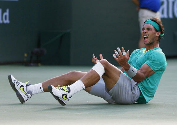 Rafael Nadal of Spain celebrates defeating Juan Martin Del Potro of Argentina in the men's singles final match to win the BNP Paribas Open ATP tennis tournament in Indian Wells, California, March 17, 2013. Comeback maestro Nadal wins third Indian Wells title