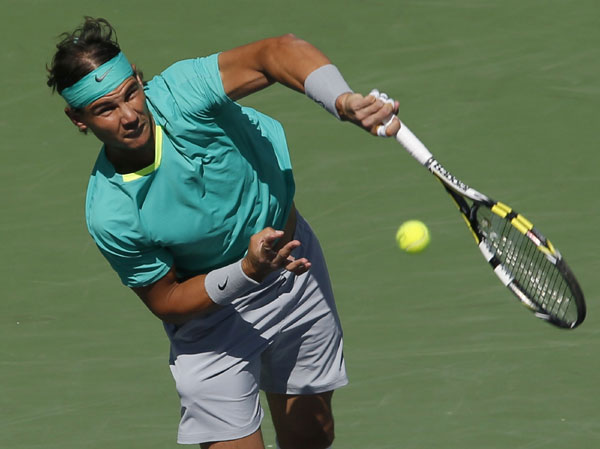 Rafael Nadal of Spain serves to Juan Martin Del Potro of Argentina during their men's singles final match at the BNP Paribas Open ATP tennis tournament in Indian Wells, California, March 17, 2013. Comeback maestro Nadal wins third Indian Wells title