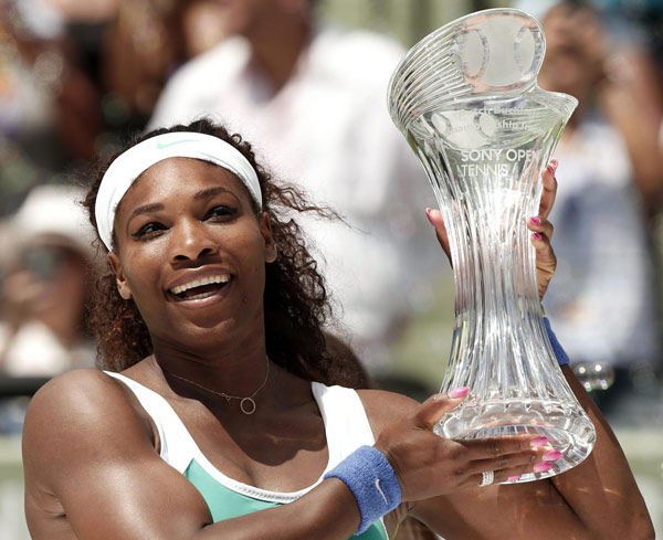 Serena Williams of the US holds the trophy after her victory over Maria Sharapova of Russia in women's final at the Sony Open tennis tournament in Key Biscayne, Florida March 30, 2013. Serena beats Sharapova in Sony Open final