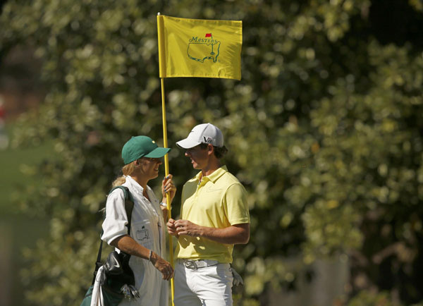 Rory McIlroy of Northern Ireland (R) and his girlfriend, tennis player Caroline Wozniacki of Denmark, stand together during the annual Masters Par 3 Contest at the Augusta National Golf Club in Augusta, Georgia, April 10, 2013. Maturing McIlroy calls talk of rivalry with Woods premature