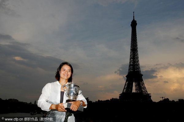 Women's singles champion Li Na of China poses with the champion's trophy by the banks of the River Seine after the French Open women's singles final match in Paris, on June 4, 2011. Li Na on Time cover, makes influential 100 list