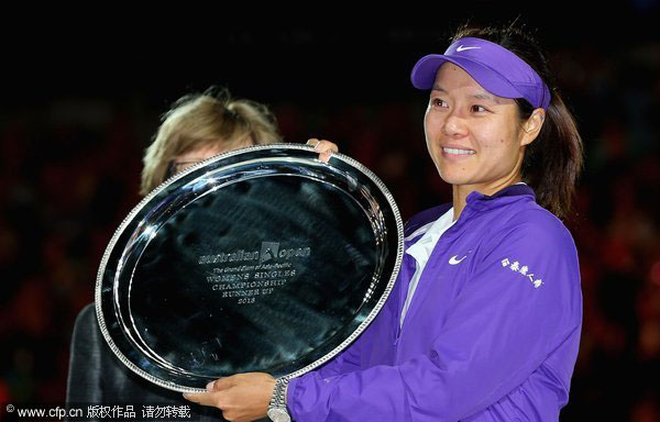 Li Na of China poses with the runner-up trophy after losing her women's singles final match against Victoria Azarenka of Belarus during the 2013 Australian Open final at Melbourne Park in Melbourne, Jan 26, 2013. Li Na on Time cover, makes influential 100 list