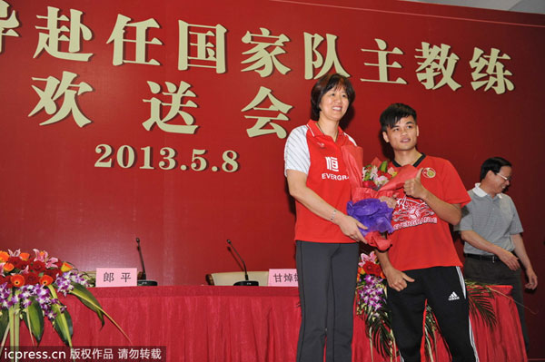 Lang Ping, left, head coach of Guangdong Evergrande Women's Volleyball Club, attends a farewell ceremony in Guangzhou, Guangdong province, on May 8, 2013. Evergrande holds farewell ceremony for Lang Ping