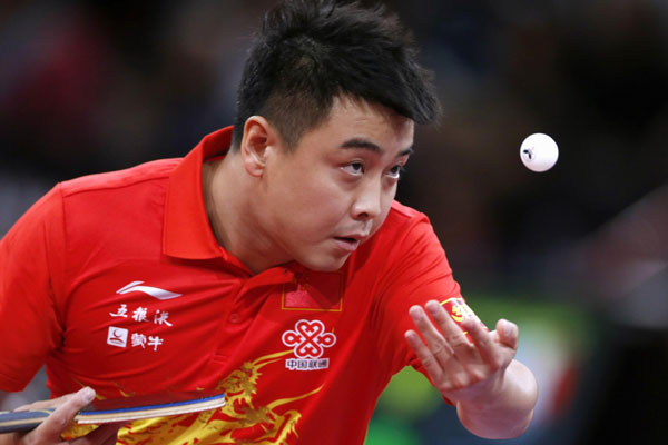 Wang Hao of China serves to Marcos Madrid of Mexico during their men's singles opening round at the World Team Table Tennis Championships in Paris May 15, 2013. Chinese stars all advance at table tennis worlds