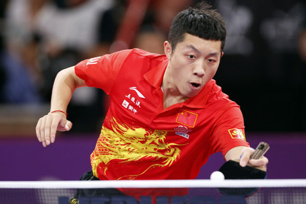 China's Xu Xin plays against Steffen Mengel of Germany in their men's singles opening round at the World Team Table Tennis Championships in Paris, May 15, 2013. Chinese stars all advance at table tennis worlds