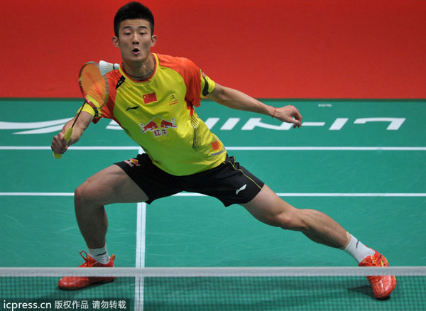 Cheng Long of China hits a return against Sugiarto Tommy of Indonesia during their match at the 2013 Sudirman Cup world team badminton championships in Kuala Lumpur, on May 21, 2013. China sweeps Indonesia to reach quarters at Sudirman Cup