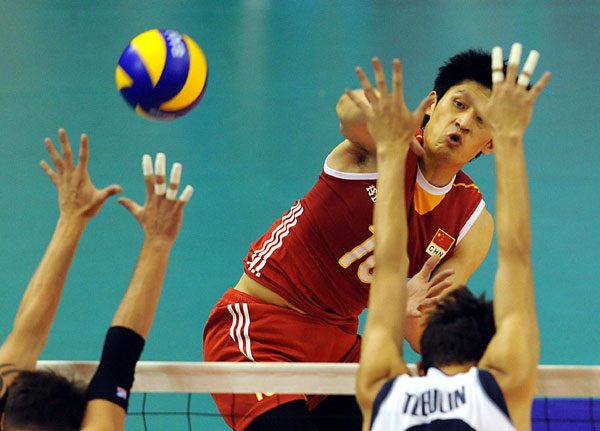 Wang Chen of China spikes against Kazakhstan during the 2013 China International Men's Volleyball Tournament in Luohe, Henan province, May 21, 2013. China defeats Kazakhstan at men's volleyball tournament