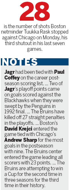 Chicago Blackhawks defenseman Niklas Hjalmarsson (bottom) takes down Boston Bruins left wing Daniel Paille (20) during the second period in Game 3 of the NHL Stanley Cup Final in Boston on Monday. Rask is brilliant as Bruins take 2-1 lead