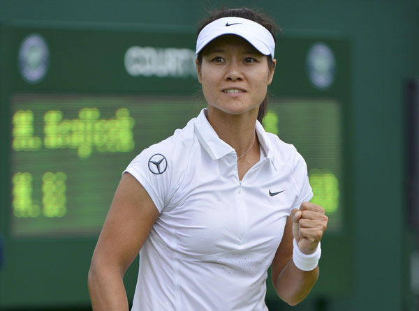 Li Na of China celebrates after defeating Michaella Krajicek of the Netherlands in their women's singles tennis match at the Wimbledon Tennis Championships, in London June 25, 2013. Djokovic, Williams, and China's Li win openers