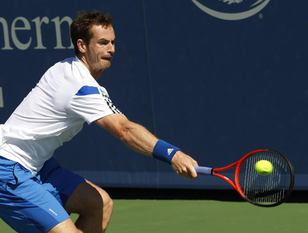 Andy Murray of Britain hits a return ball to Mikhail Youzhny of Russia at the Men's Cincinnati Open tennis tournament in Cincinnati, Ohio August 14, 2013. Murray, Djokovic on Cincinnati collision course