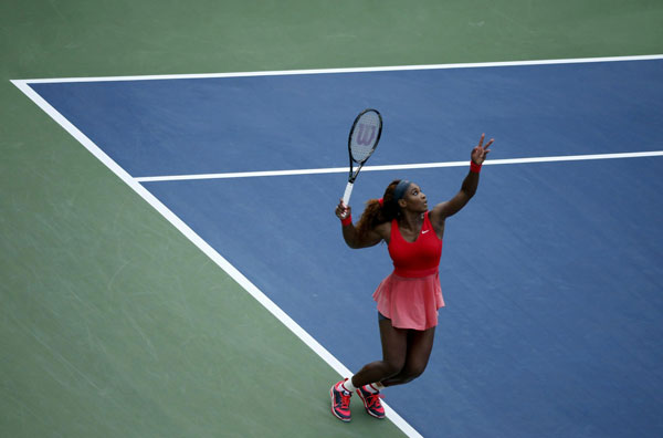 Serena Williams of the U.S. serves to compatriot Sloane Stephens at the U.S. Open tennis championships in New York September 1, 2013. Serena beats Stephens as Murray cruises