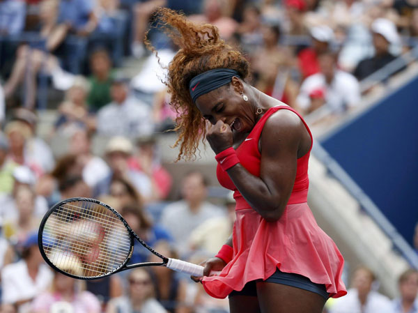 Serena Williams of the U.S. reacts after winning a point against compatriot Sloane Stephens at the U.S. Open tennis championships in New York September 1, 2013. Serena beats Stephens as Murray cruises