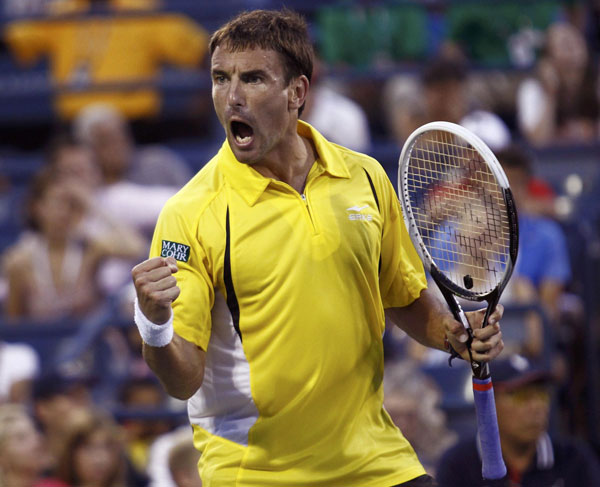 Tommy Robredo of Spain celebrates in the second set against Roger Federer of Switzerland at the U.S. Open tennis championships in New York September 2, 2013. Federer knocked out of US Open by Robredo