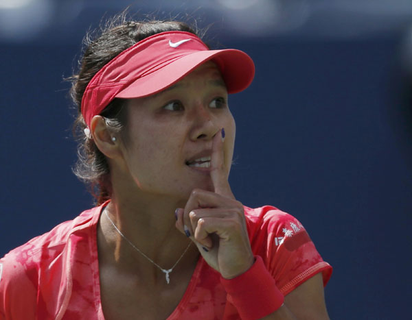 Li Na of China reacts to a point against Ekaterina Makarova of Russia at the US Open tennis championships in New York, Sept 3, 2013. Li Na becomes China's first US Open semifinalist