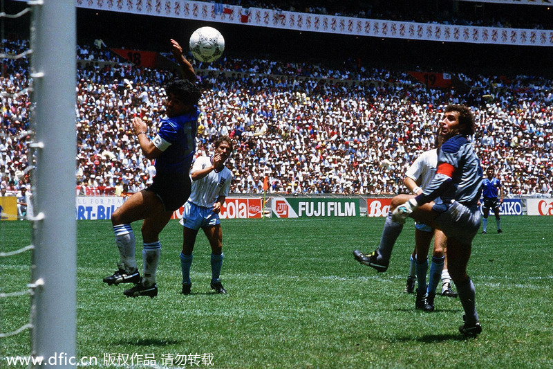 Argentina's Diego Maradona scores the first goal with his Hand of God, past England goalkeeper Peter Shilton during their quarterfinals at the 1986 Mexico FIFA World Cup, June 22, 1986. Tantrums, trickery and tragedies of World Cups past