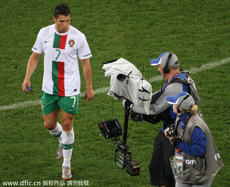 Cristiano Ronaldo appears to spit as a television camera closes in on him after the Portuguese defeat to Spain during the 1/8 finals at the South Africa World Cup, June 29, 2010. Tantrums, trickery and tragedies of World Cups past