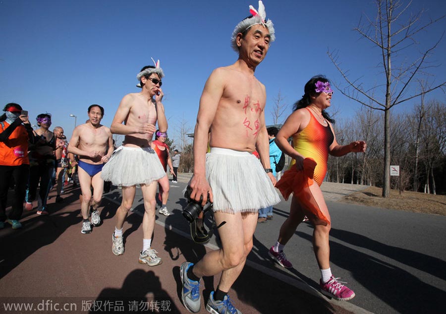 Monkey king, angel and superwoman at Beijing's 'naked run' race
