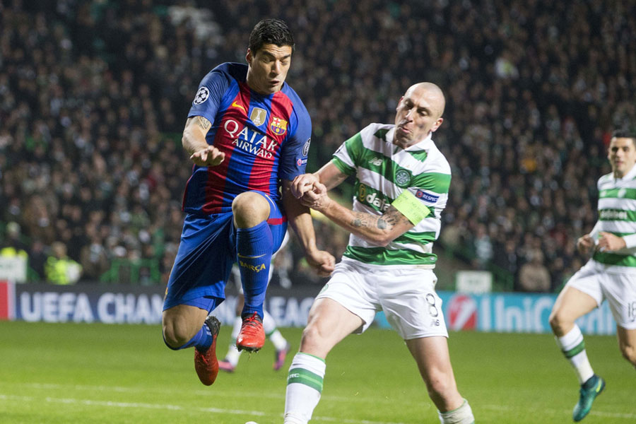 Messi double guides Barcelona to 2-0 win at Celtic