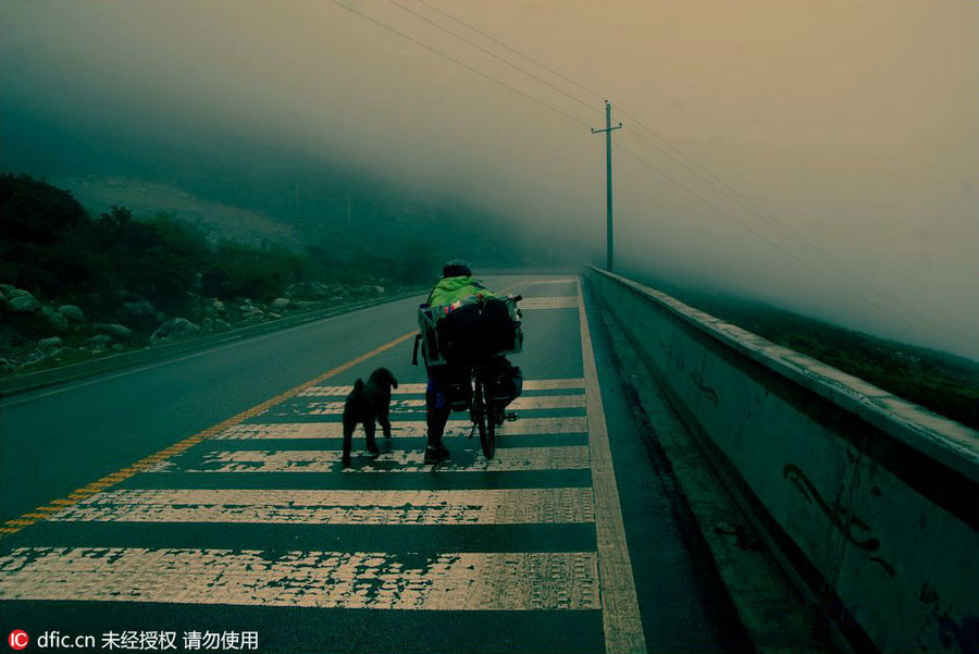 A man and a dog: Traveling around the world on cycle