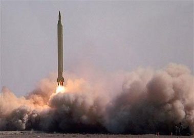 A top Iranian military official said Tuesday the country can now defend itself against any invasion originating from outside the region  a clear reference to the United States  as it tested a second new radar-avoiding missile. 