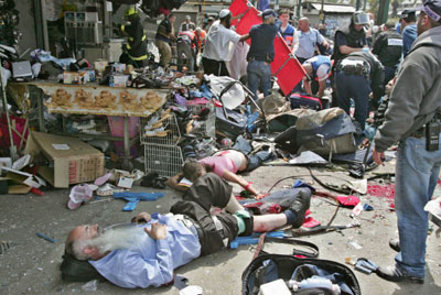 A Palestinian suicide bomber struck a packed fast-food restaurant during Passover on Monday, killing nine people and wounding dozens in the deadliest bombing in more than a year.