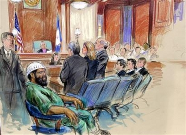 This artist's rendering shows Zacarias Moussaoui, left, his defence team, standing from left, Alan Yamamoto, Anne Chapman, and Gerald Zerken, the prosecution team, seated from left, Robert Spencer, David Raskin, and David Novak, in U.S. District Court in Alexandria, Va., as the sentence for Moussaoui, life in prison, is read, Wednesday, May 3, 2006.