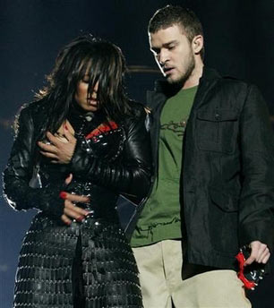 Janet Jackson (L) reacts after fellow singer Justin Timberlake ripped off one of her chest plates, revealing one breast, at the end of their half time performance at Super Bowl XXXVIII in Houston, February 1, 2004. The U.S. Federal Communications Commission upheld on Wednesday its decision to fine 20 CBS Corp. television stations a total of $550,000 for airing pop singer Janet Jackson's breast flash in 2004.