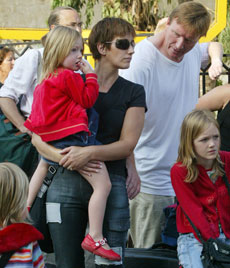 An Irish family waits to board a bus to be evacuated from Lebanon July 17, 2006.