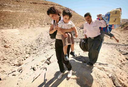 Israel is facing widespread outrage over an airstrike Sunday that killed 56 civilians, almost all of them women and children, when it leveled a building where they had taken shelter. [Reuters]