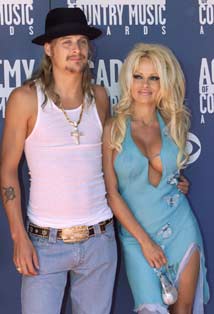 Singer Kid Rock and actress Pamela Anderson arrive at the 37th annual Academy of Country Music Awards in Los Angeles in this May 22, 2002 file photo. Anderson has filed for divorce from Rock after four months of marriage, a pair of celebrity magazines reported on November 27, 2006.