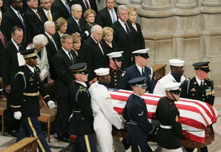 Former U.S. Presidents (L-R) George H. Bush, Jimmy Carter, Gerald Ford and Bill Clinton and current U.S. President George W. Bush (front row, L) watch the arrival of the remains of former President Ronald Reagan at Reagan's state funeral at Washington's National Cathedral in this June 11, 2004 file photo. Ford, who took office from an embattled Richard M. Nixon, has died, according to a statement from his widow on December 26, 2006.