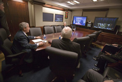 U.S. President George W. Bush (seated L) participates in a secure video teleconference with Iraq's Prime Minister Nouri al-Maliki from the newly-renovated Situation Room at the White House January 4, 2007. Vice President Dick Cheney is pictured sitting next to the President.