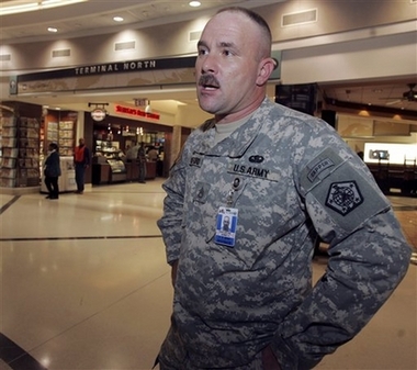 .S. Army staff sgt. James Woodford talks to a reporter after watching President Bush's address at Hartsfield Jackson Atlanta International Airport in Atlanta, Wednesday, Jan. 10, 2007. Woodford, who helps soldiers returning from Iraq through the airport, said he thinks a surge in troops size in Iraq is a good idea. (AP