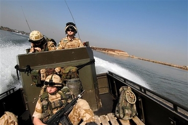 In this recent but undated image released by the British Royal Marines, marines from 539 Assault Squadron Royal Marines conduct operations on waterways in the Basra region of southern Iraq as part of Operation Troy. Iranian naval vessels on Friday seized 15 British sailors who had boarded a merchant ship in Iraqi waters of the Persian Gulf. British officials do not know where Iran is holding 15 sailors and marines captured in the Persian Gulf, and requests for access to them have been denied, the Foreign Office said Sunday as Tehran again protested what it called their illegal entry into Iranian waters. (AP 
