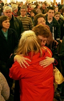 People embrace each other in the Blacksburg Presbyterian Church during a gathering for the victims of the shooting at Virginia Tech Monday, April 16, 2007, in Blacksburg, Va. (AP 