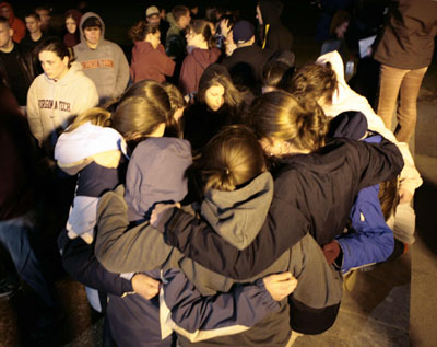 Students comfort one another