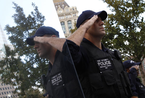 A Port Authority police officer salutes during ceremonies marking the 10th anniversary of the 9/11 attacks on the World Trade Center in New York, Sept 11, 2011. Mourning for 9/11 victims