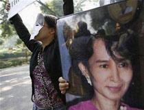 A Myanmar pro-democracy activist holds a picture of Nobel Prize winner Aung San Suu Kyi during a protest in New Delhi Oct. 19, 2007.