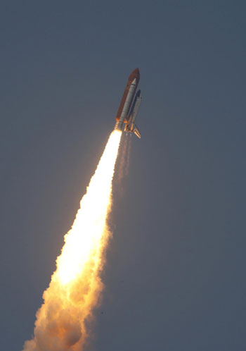 Atlantis inspected for damage while chasing Hubble