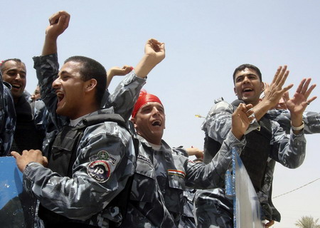 Fireworks over Baghdad as Iraqis take over cities