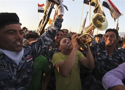 Fireworks over Baghdad as Iraqis take over cities