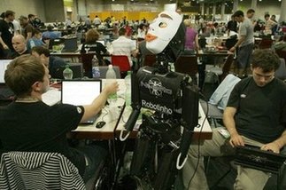 Robots face off on football pitch, in kitchen at RoboCup 2009