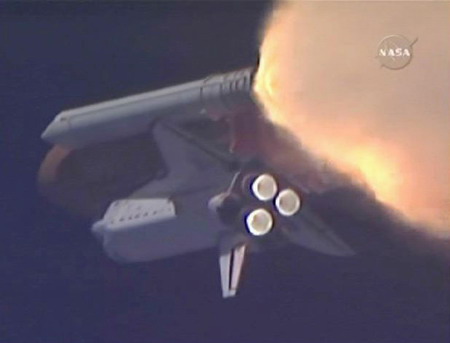 On sixth try, space shuttle lifts off