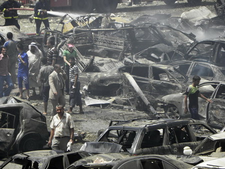 Waves of Baghdad blasts kill 97
