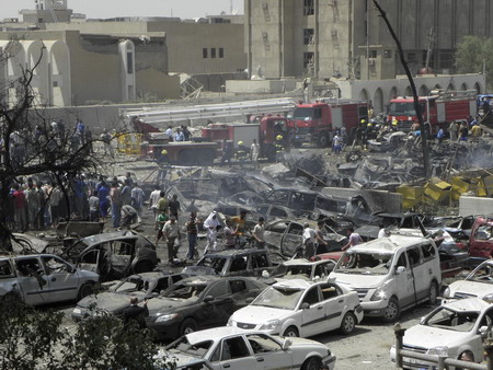 Waves of Baghdad blasts kill 97