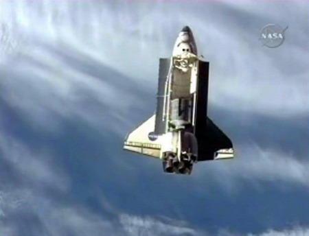 Shuttle Discovery reaches space station