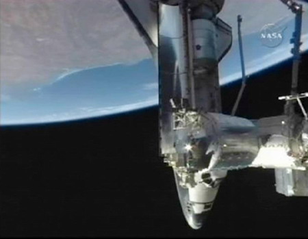 Shuttle Discovery reaches space station