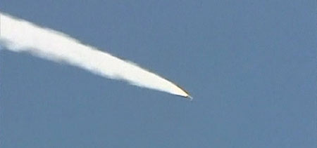 Under pressure for nukes, Iran test fires missiles