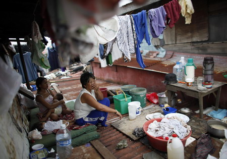 Tens of thousands in Philippines flee new typhoon