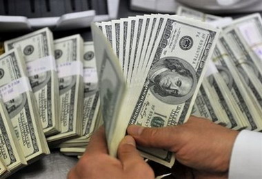 Oil above $71 as global stocks gain, dollar drops